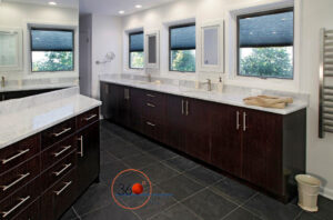 Pella Designer Series wood windows in modern bathroom, featuring white interior frames, frosted and clear glass, and energy efficient performance